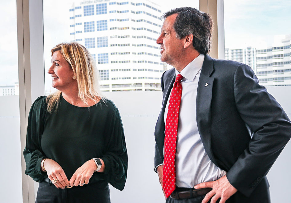 Fort Lauderdale and West Palm Beach Market Executive Kelley Brown-Murro, left, and Florida Commercial Banking Executive Tony Stiffler take a moment to view the skyline from Region’s office in Fort Lauderdale.