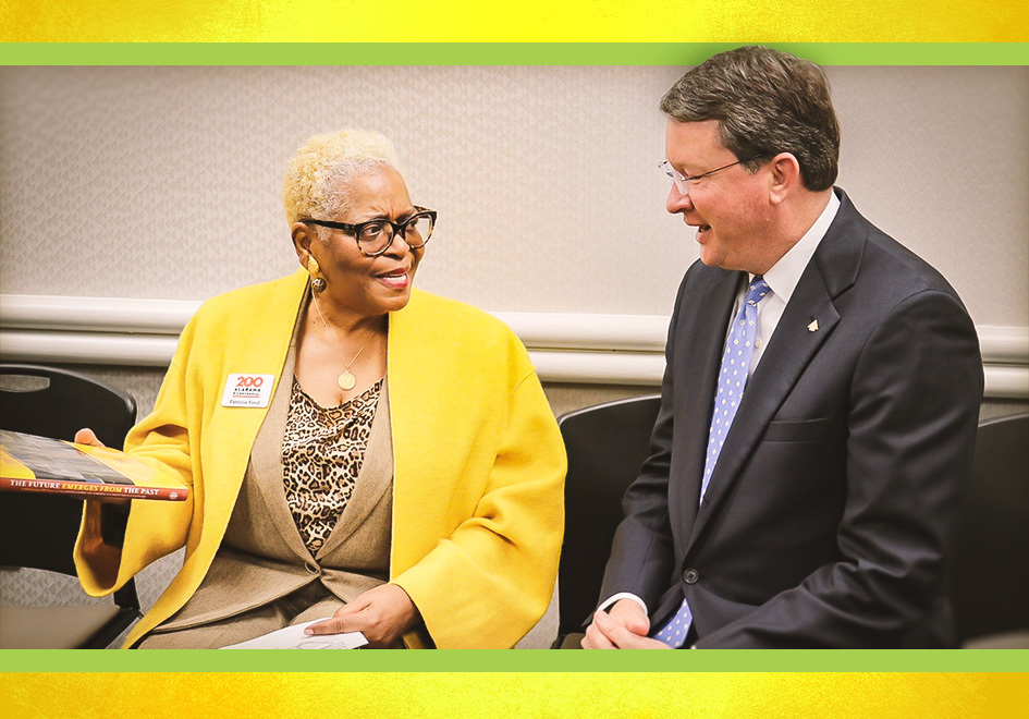 Patricia Ford, left, Director of the State Black Archives Research Center & Museum, is part of the Alabama Bicentennial Commission. Here, she speaks with Robert Birmingham, right, Executive Vice President from Regions in Montgomery, about the new book.