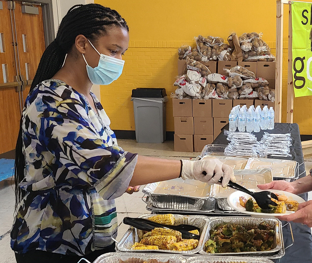 Nicole Woodson serving food