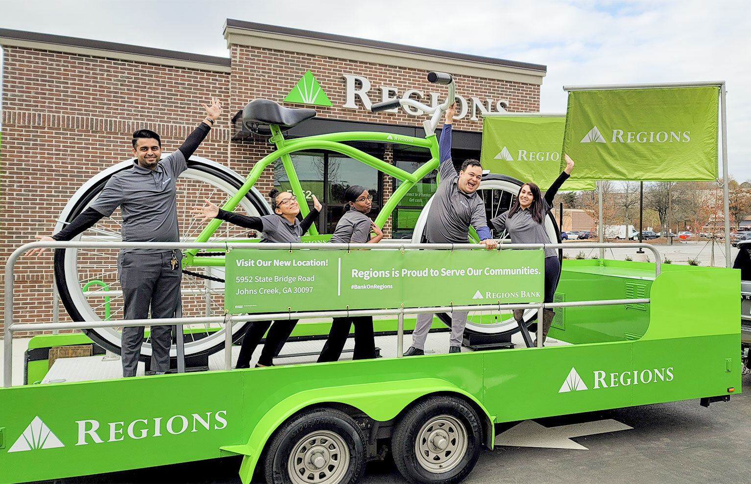 regions associates on big green bike trailer