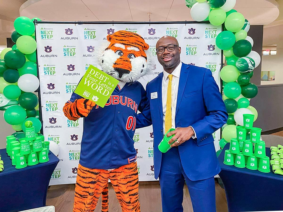 Aubie the tiger mascot with Regions Associate