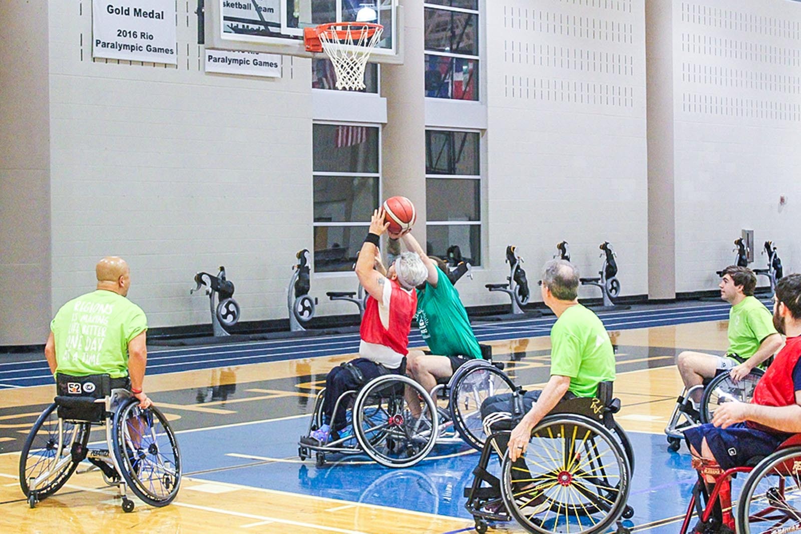 action shot of wheelchair basketball game