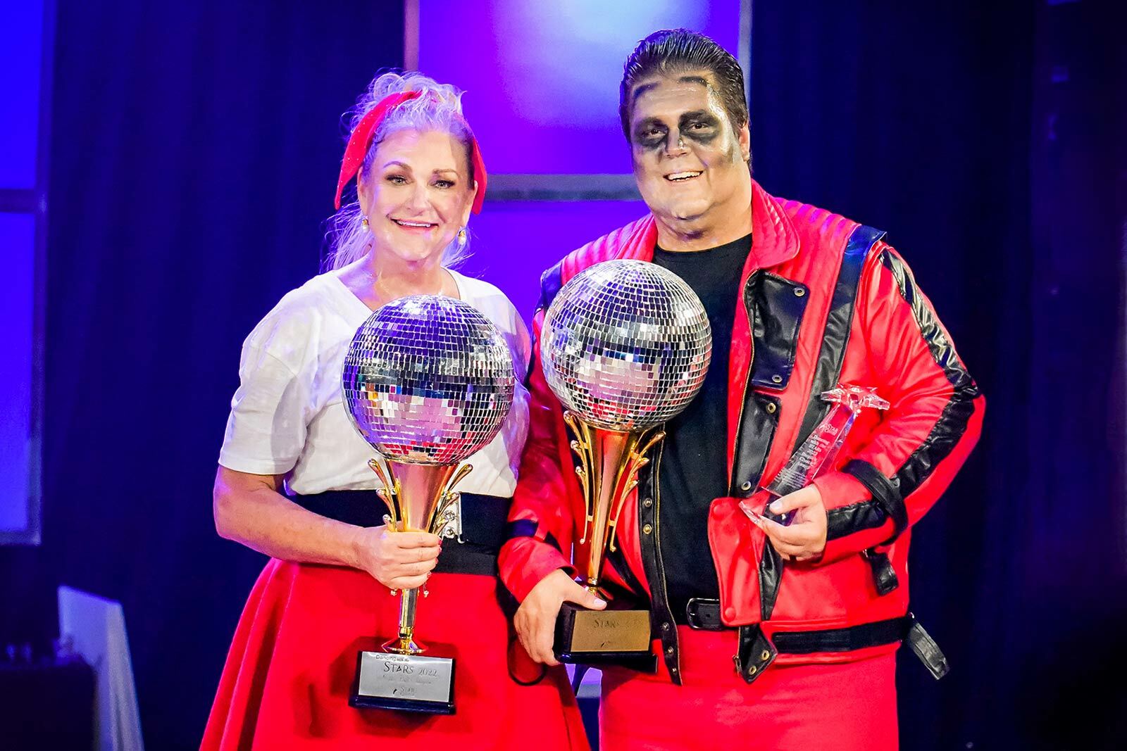 Jonathan and Marda with mirror ball trophies