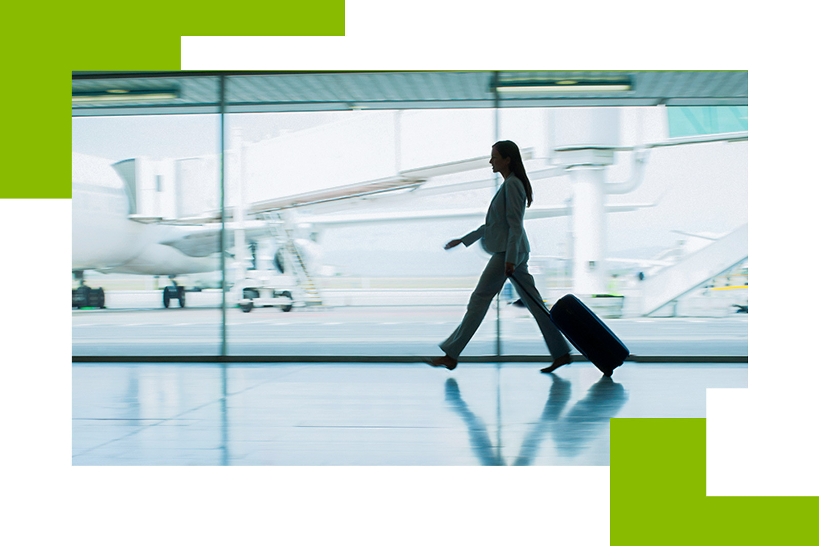 woman in silhouette walking through an airport