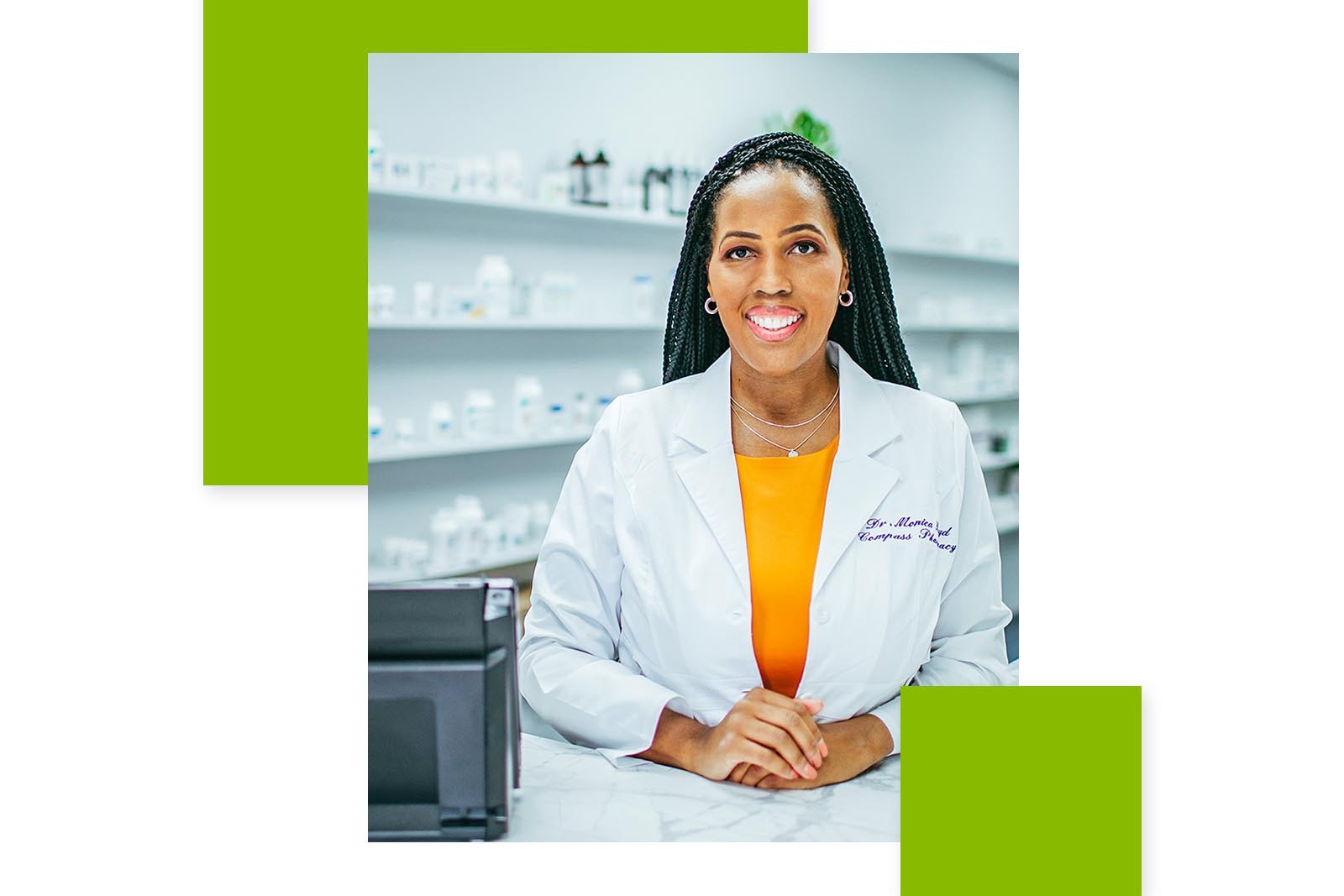 Monica Boyd behind a counter at Compass Pharmacy, smiling at...