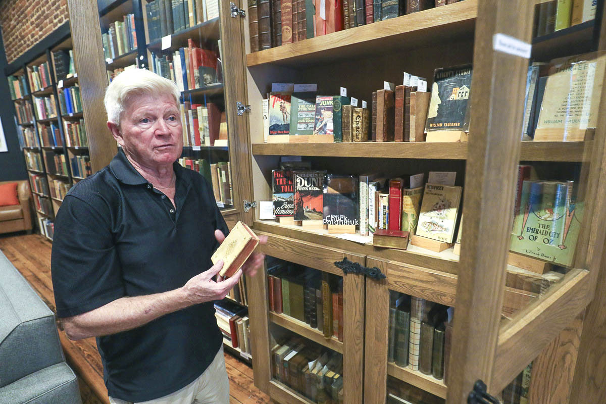 Brian Worley displays vintage titles in Addison's Books