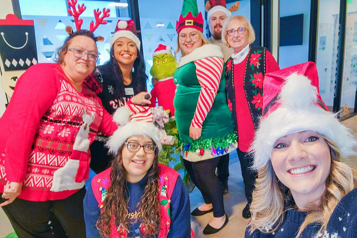 Group of associates wearing Christmas clothes