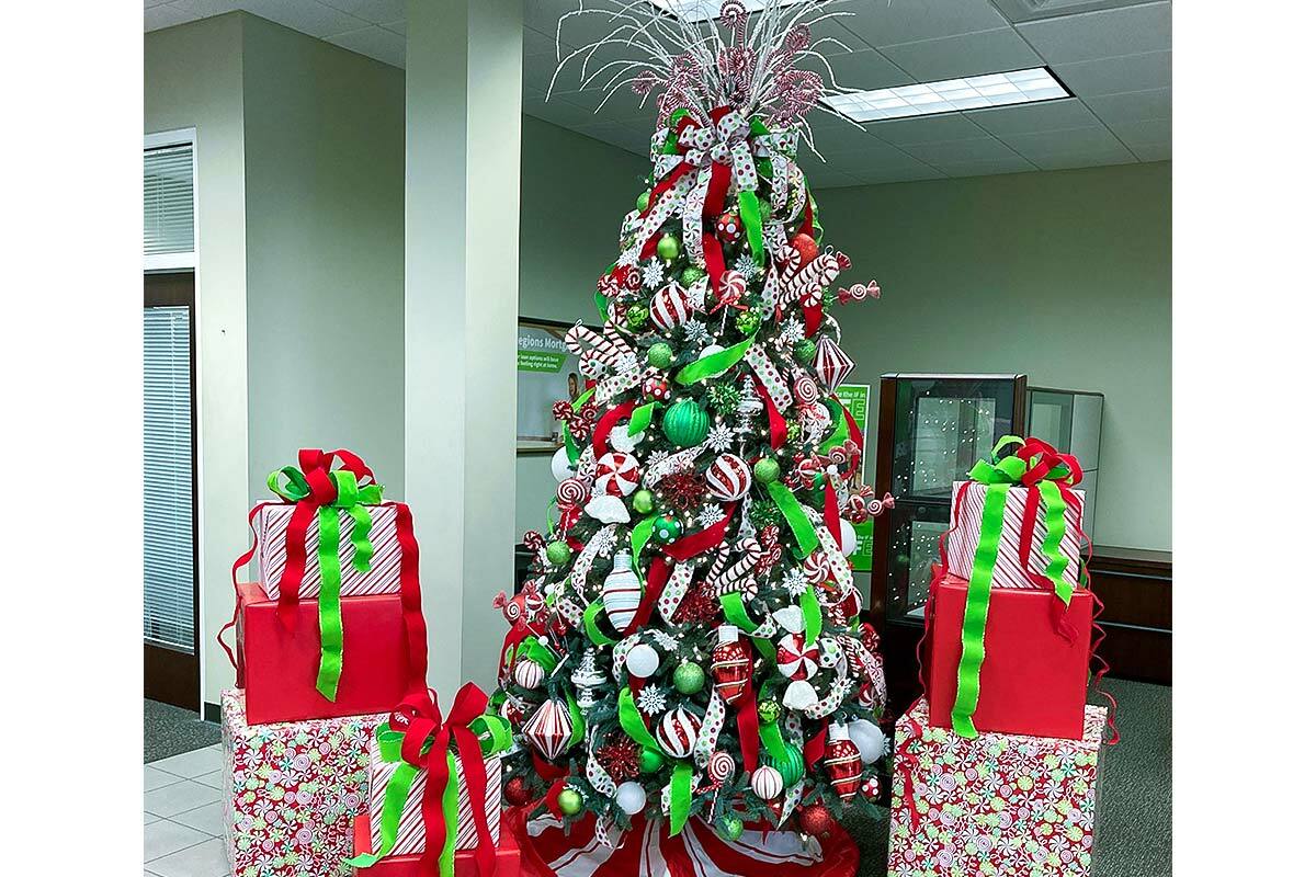 Christmas tree decorated for holiday in Regions Bank brand colors
