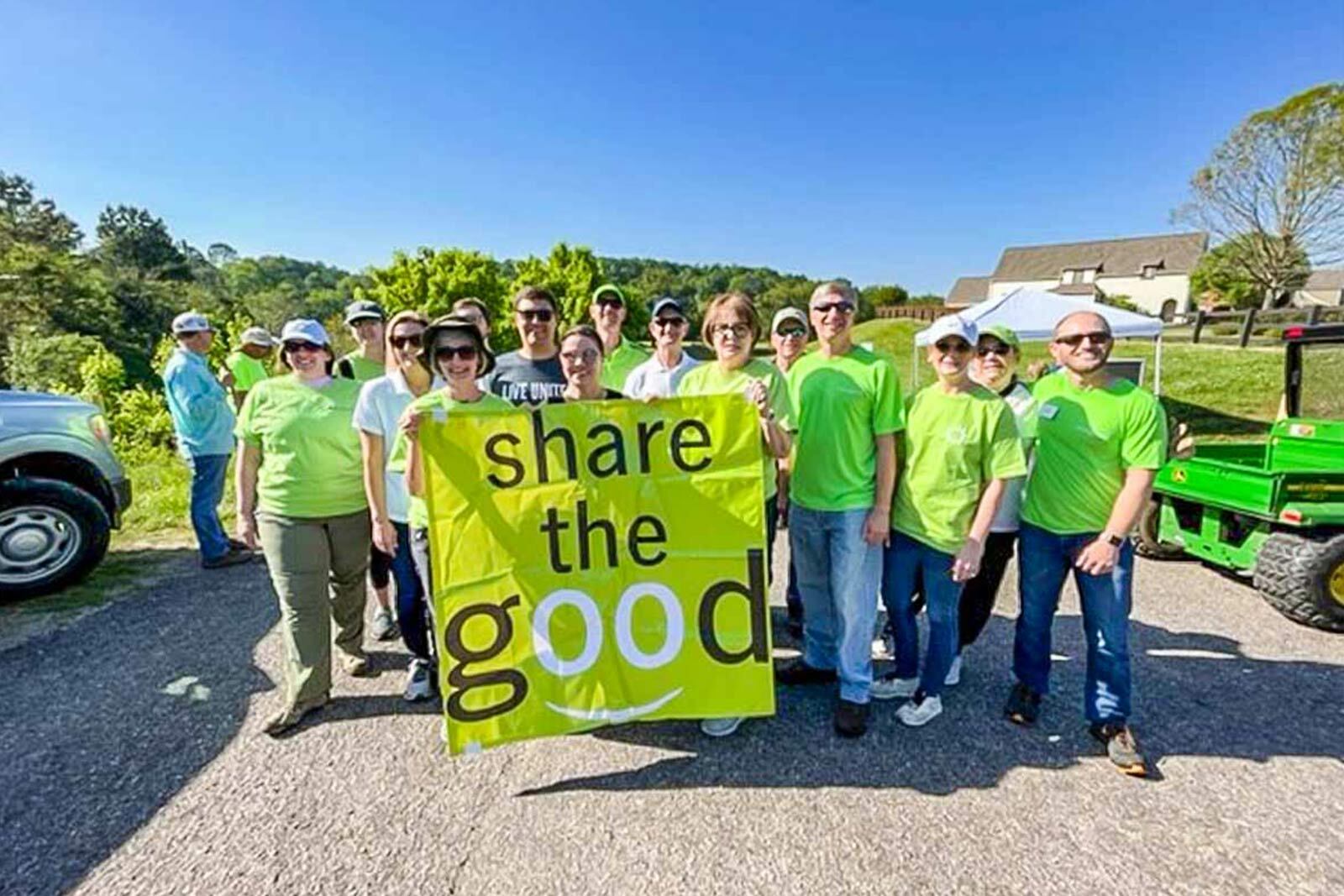 Group of Regions associates holding the Share the Good sign