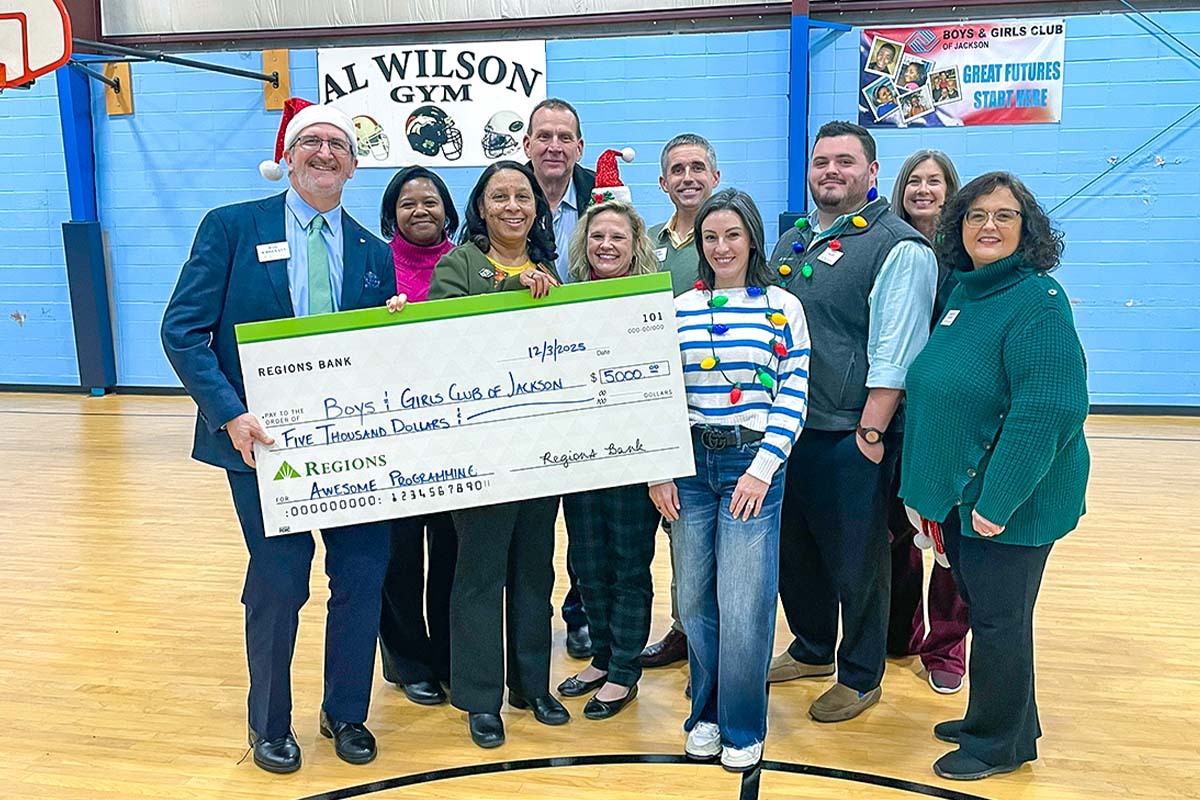 Miles of Smiles Regions initiative in Jackson, Tennessee — Regions associates delivering a check to the Boys & Girls Club of Jackson.