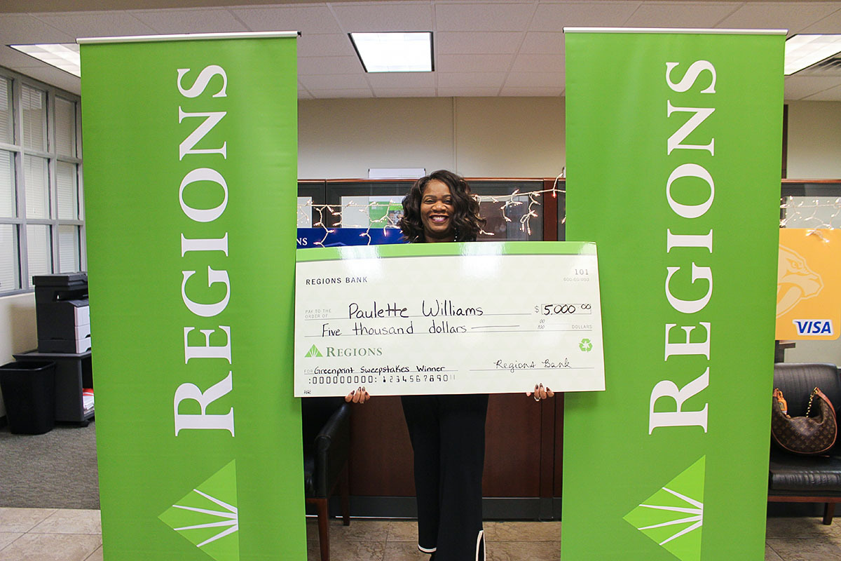 Paulette Williams with giant Regions Greenprint Sweepstakes check.