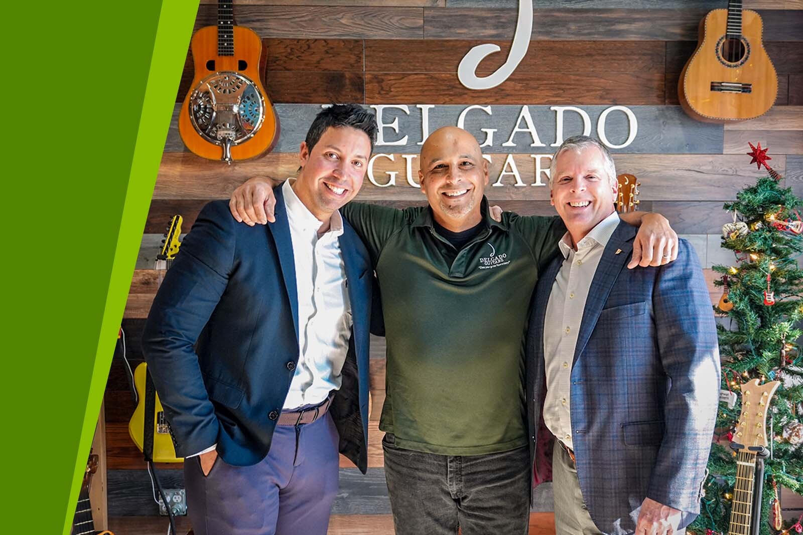 Darien Rizo, Manuel Delgado, and Chris Claybrook smile in front...