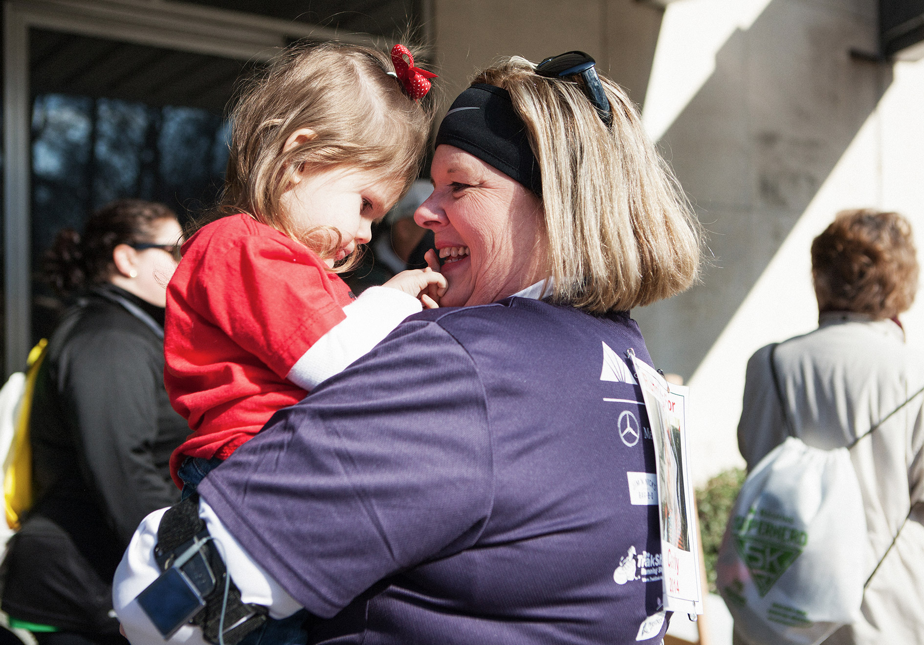 Carly Chandler and and her grandmother, Denise Hill, celebrate the Regions Superhero 5k Run