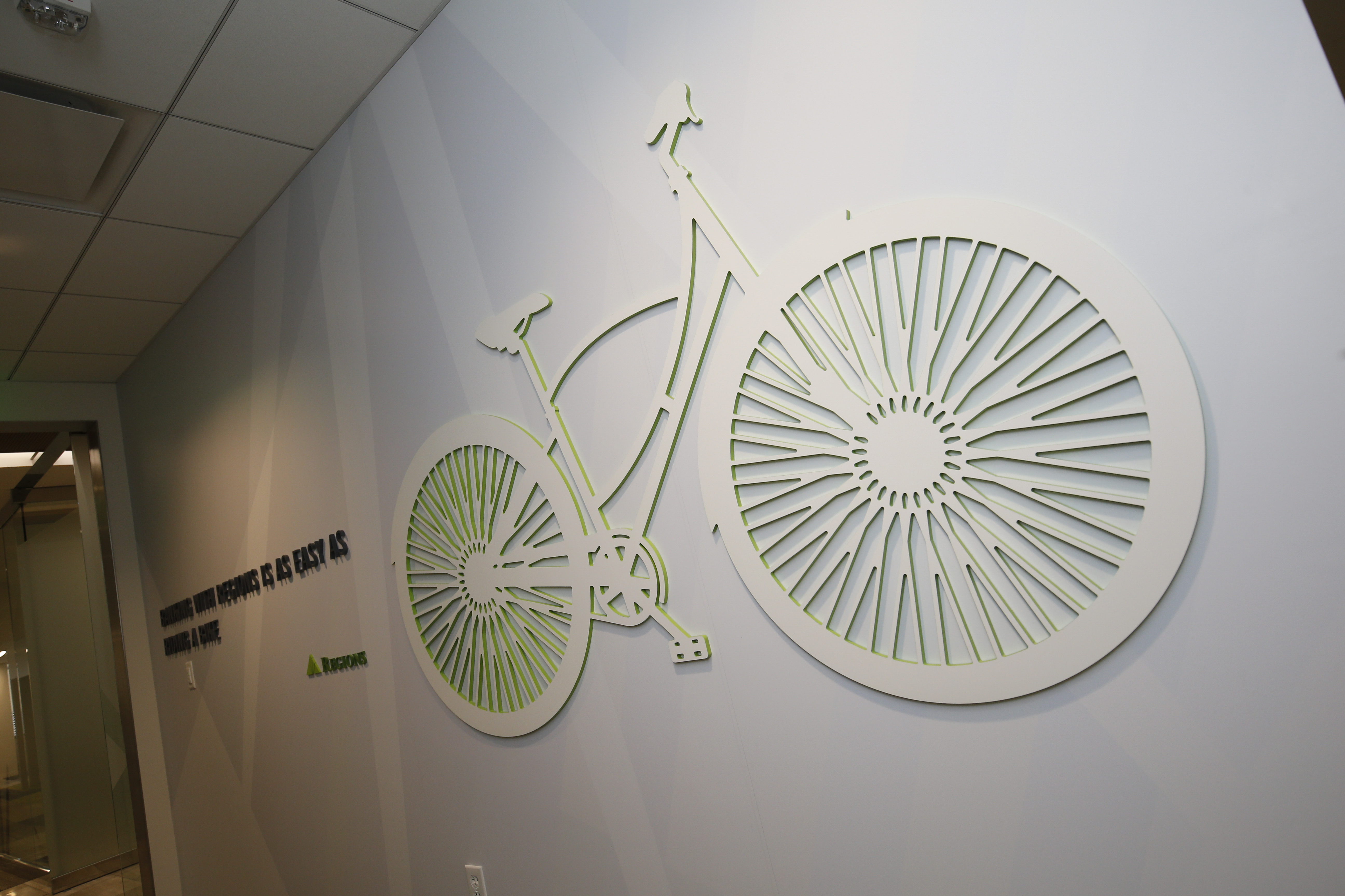 image of bike on wall in Regions Bank office