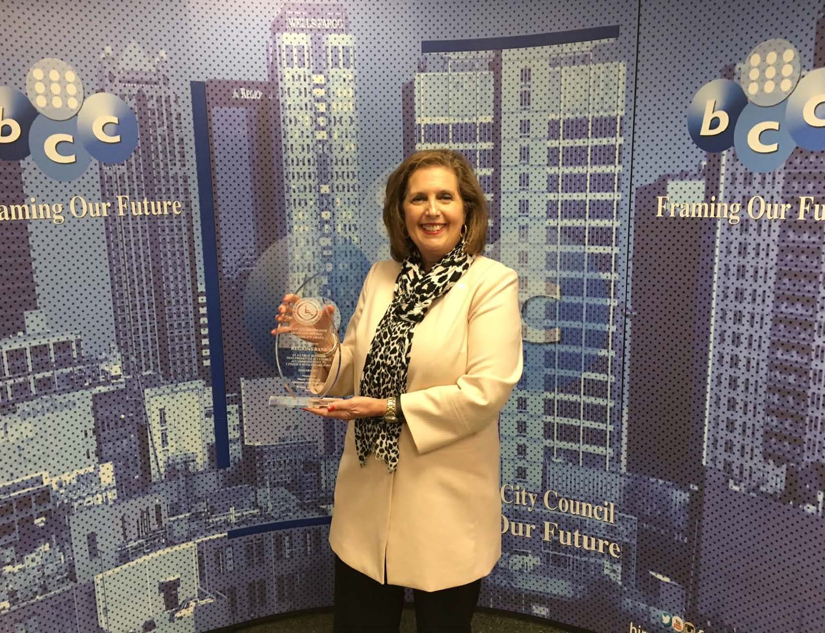 Kathy Lovell accepts the Above and Beyond Award for Regions