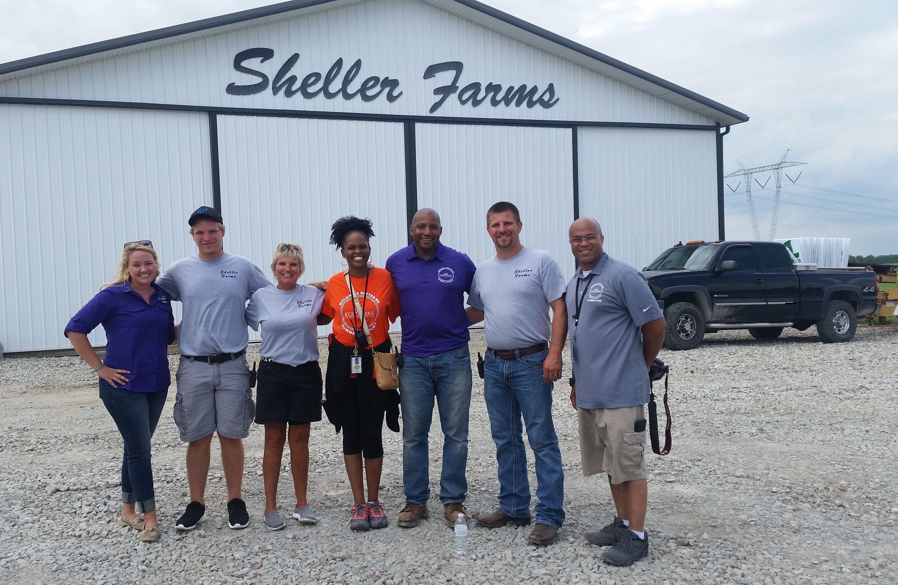 people standing in front of Sheller Farms