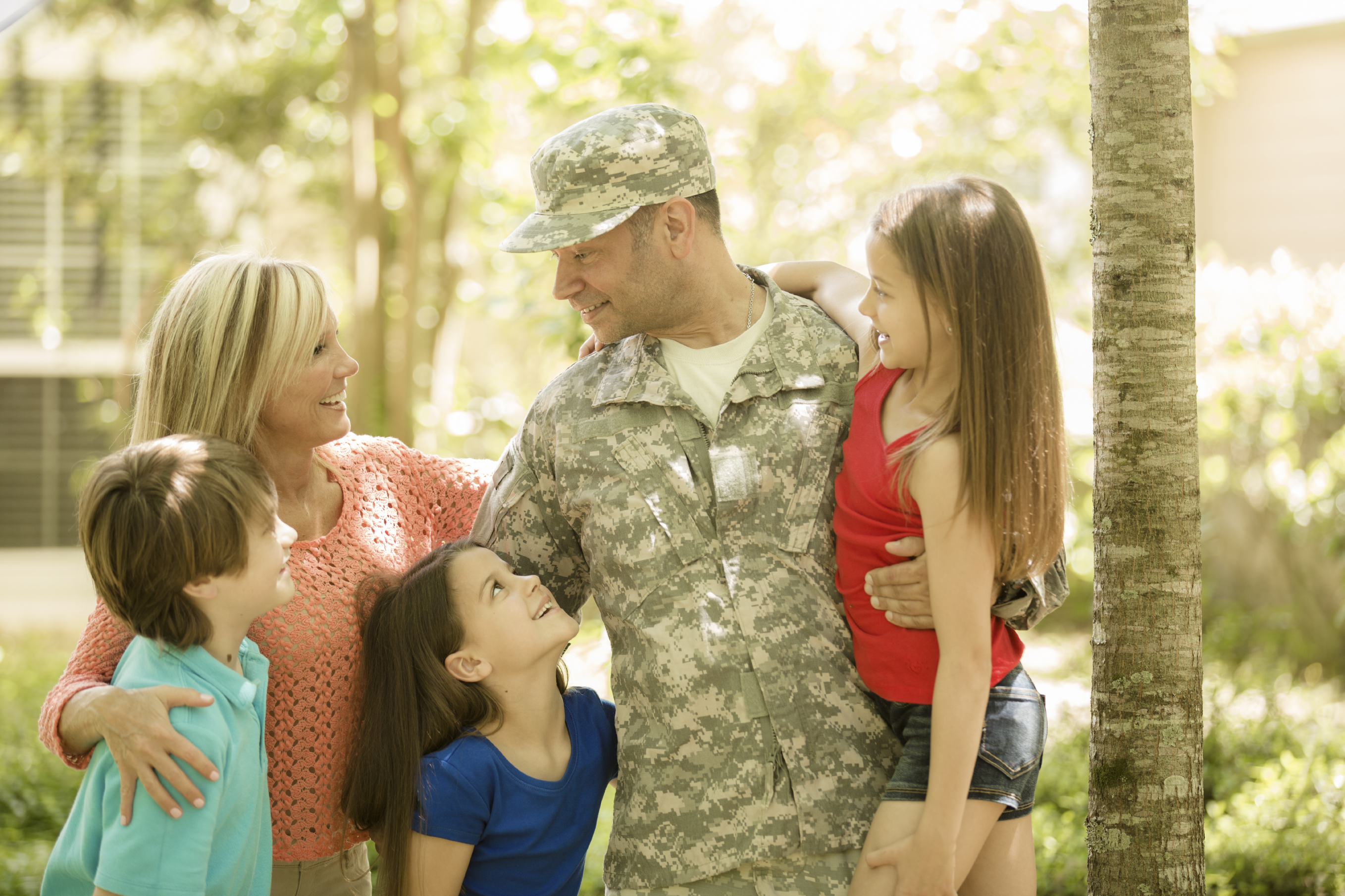 armed forces man with his family