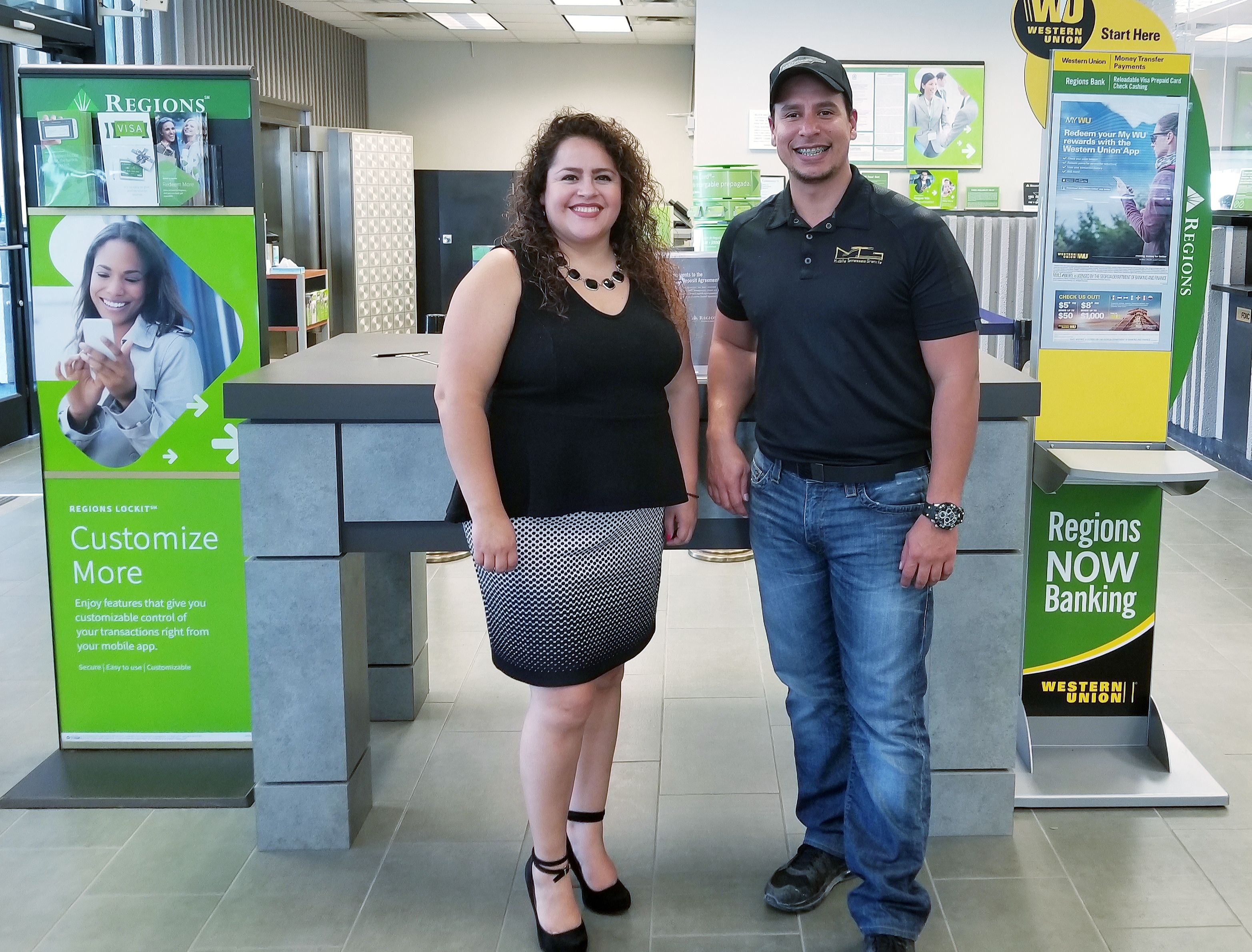 man and woman standing inside bank branch