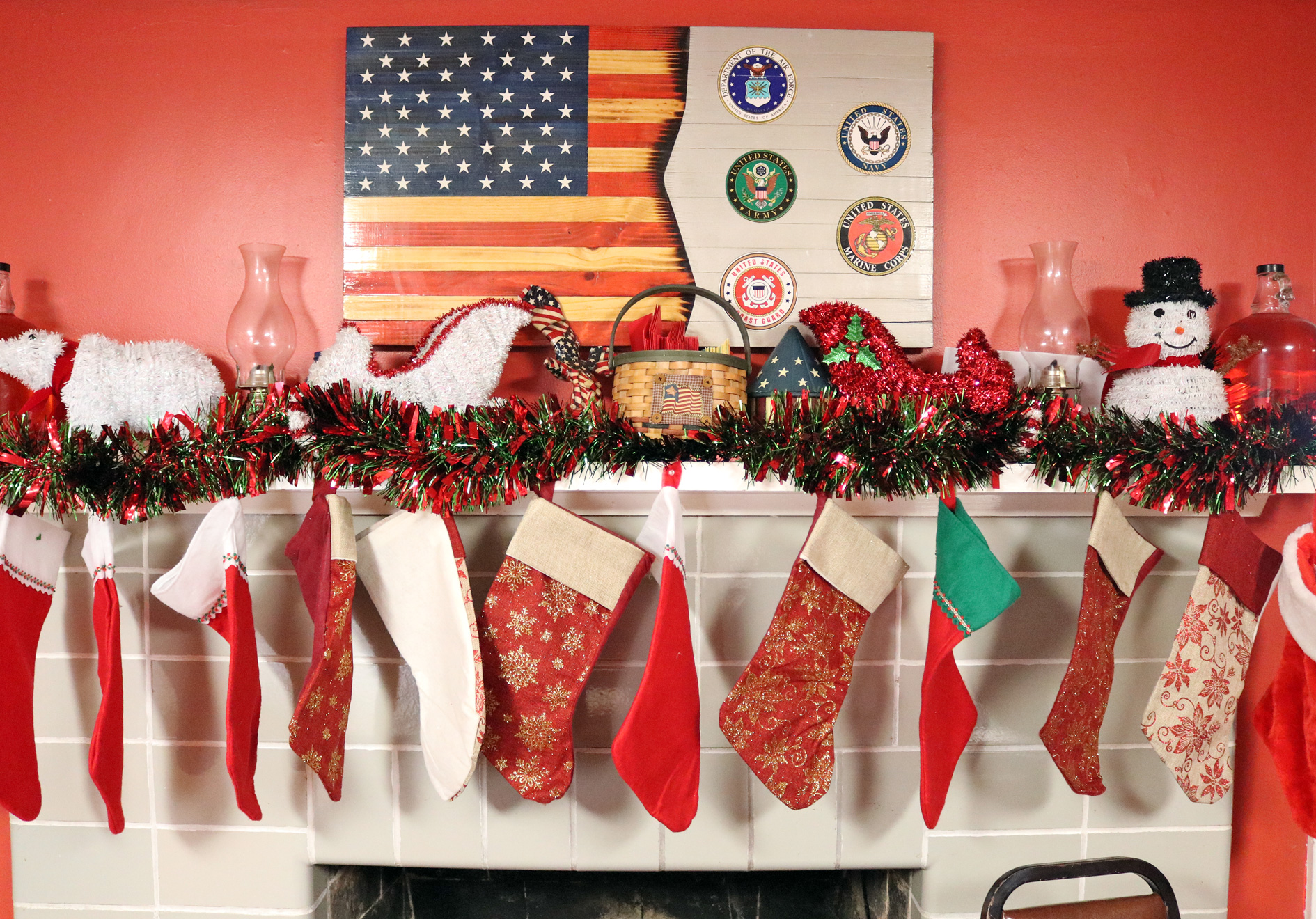 mantel with Christmas decoration and armed forces symbols