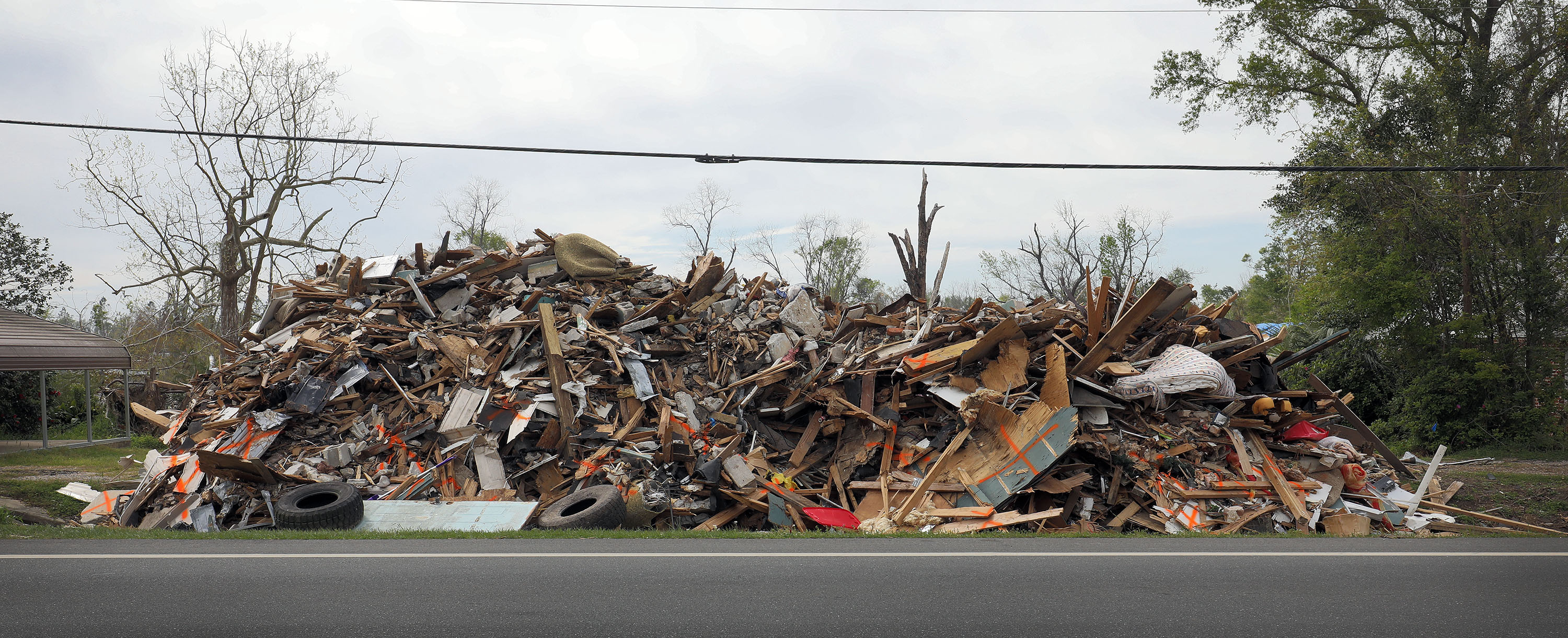 hurricane disaster debris on the side of the road
